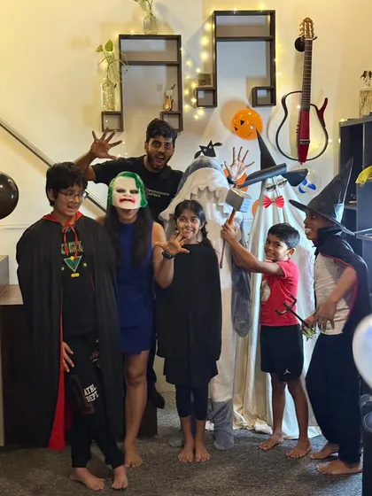 The whole gang is here! Students and teachers showing off their fun and spooky costumes during our Halloween event at the school.
