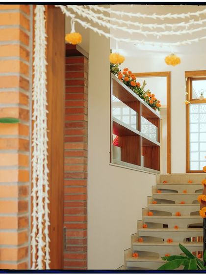 A shot of the staircase decorated with marigolds for the housewarming.