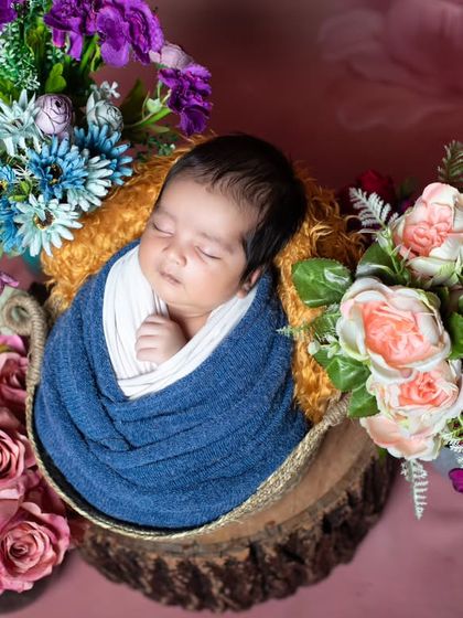 Another angle of the floral basket setup, showing the rich colors of the flowers.