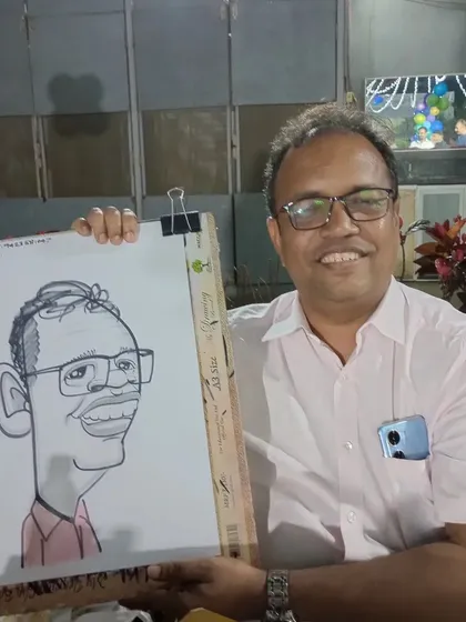 A guest from the birthday party, happy with his portrait.