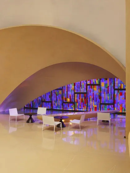 This colorful, stained-glass effect wall is one of the many architectural highlights at The Roseate. It creates a beautiful, calming light in our lounge area.
