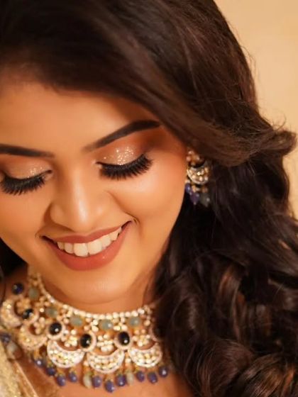 A downward glance showcasing the sparkling diamond glitter on Payal's eyes. This is a perfect example of a dreamy, romantic reception look that feels utterly glamorous.