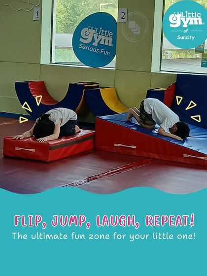 Flip, jump, laugh, repeat. Two children practice forward rolls on wedge mats, a foundational gymnastics skill that teaches body control and spatial awareness in a safe way.