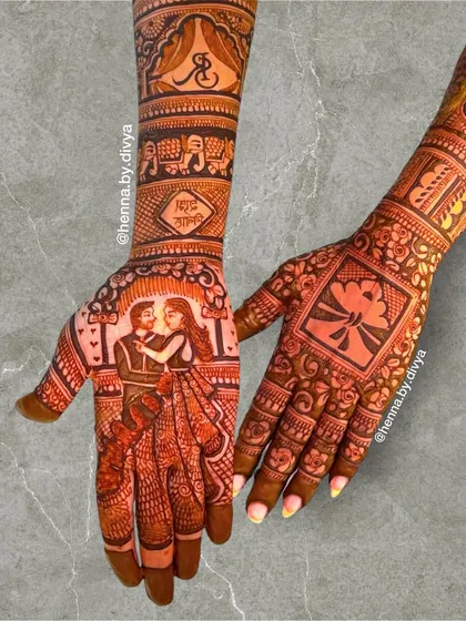 A stunning bridal mehendi featuring a detailed portrait of the couple. The design also includes traditional wedding symbols and extends up the arm with intricate patterns.