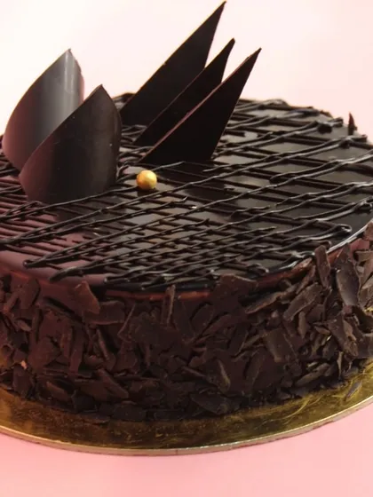 My signature Dutch Truffle chocolate cake is a bestseller for a reason. It's a rich, moist, and intensely chocolatey cake that is a guaranteed crowd-pleaser for any occasion.