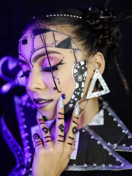 A side profile, focusing on the details of the makeup and hairstyle.