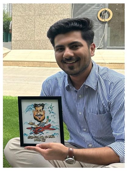 A happy client with his personalized caricature. Seeing that smile makes all the hours I spend drawing completely worth it.