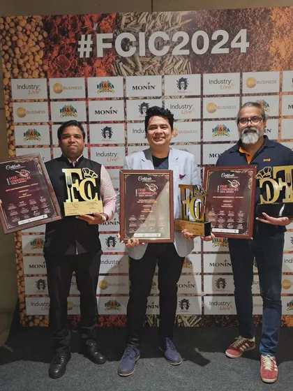 Me and my partners proudly posing with our three awards from FCIC 2024.