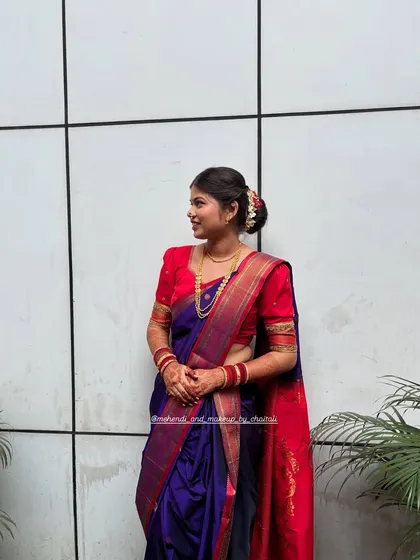 A side view showcasing the traditional hairstyle and the clean lines of the Nauvari drape. My goal is to create a polished and authentic look.