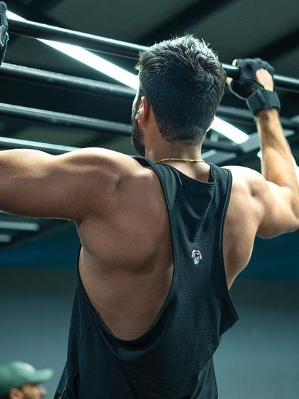 A strong back is a healthy back. This member demonstrates the power and definition that comes from consistent pull-up training.