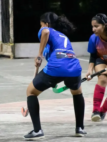 A defender works to tackle an opponent and win back the ball. Strong defensive skills are a core part of our training philosophy.