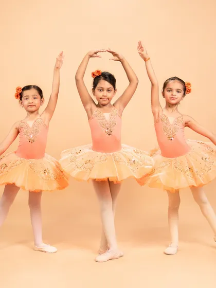 Dressed as blooming flowers, these dancers are ready for 'The Waltz of the Flowers' from The Nutcracker. Their poses capture the delicate beauty of nature's cycle, from bud to full bloom.