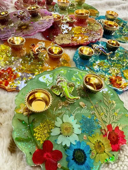 My handcrafted puja thalis are perfect for adding a pop of elegance to any celebration. I make them in a variety of vibrant colors with real flowers, making them ideal return gifts for weddings, baby showers, or any festive event. Each one is affordable, unique, and made with a lot of care.