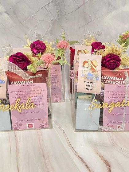 Thoughtful corporate gifts for Mother's Day. These personalized acrylic boxes were filled with treats and decorated with flowers for all the super moms at the office.
