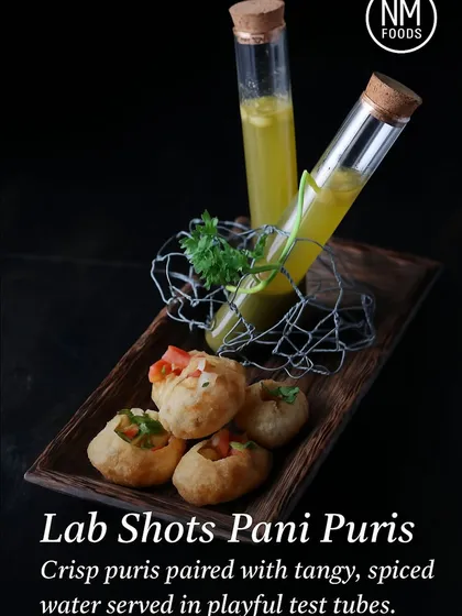 We love to add a playful twist to beloved classics. Our Lab Shots Pani Puris deconstruct the iconic street food, serving the tangy, spiced water in elegant test tubes for a fun and memorable chaat experience.