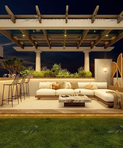A Bohemian-inspired terrace design for a Gurgaon project. The space features a pergola with classical columns, a fully equipped bar, and a lush lawn for a free-spirited, eclectic vibe.