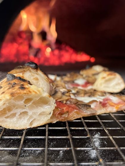 This crust is definitely worthy of your attention. See how it puffs up by the flames? That's the sign of a perfect bake.