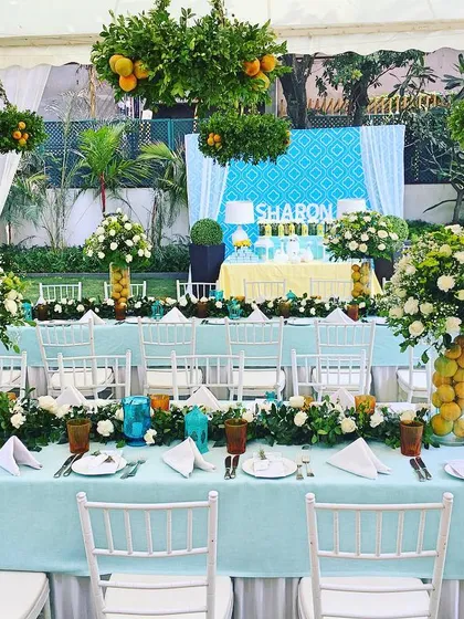 Inspired by the Mediterranean, I designed this Tuscan-style luncheon for a 50th birthday. The tablescape featured fresh citrus, white florals, and beautiful turquoise linens to create a bright and sophisticated outdoor celebration.