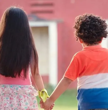 Another adorable shot of the child actors from the Grandiose Productions shoot, holding hands as they walk off set.