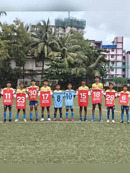 Players holding up the jerseys of the clubs they now represent, a visual representation of their journey from our grassroots program to competitive youth leagues.