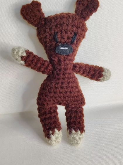 Another pose of the iconic teddy bear plushie.