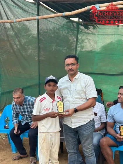 A player receiving his award at the Future Star U-12 tournament presentation.