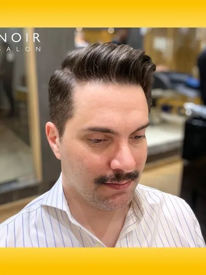 The classic pompadour is timeless for a reason. This style requires precision in both the fade and the styling on top to create that signature volume and clean side part. It’s a sophisticated look for any modern gentleman.