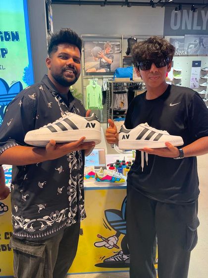 A customer showing off his new kicks personalized with his initials, "AV". It's a clean, stylish way to make a statement.