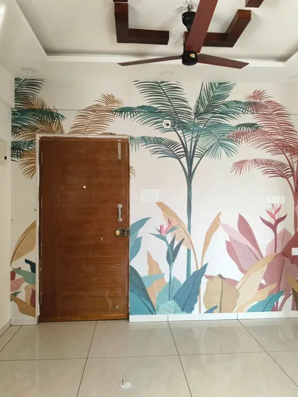 This image shows how a nature-themed mural can be designed to work around doorways. The palm tree and foliage pattern flows seamlessly across the wall, integrating the door into the overall design.