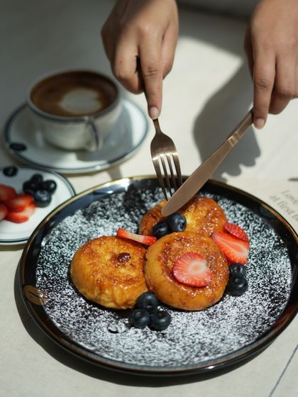 A perfect bite of my berry-topped French toast, showcasing the soft, custardy interior and the crisp, caramelized exterior.