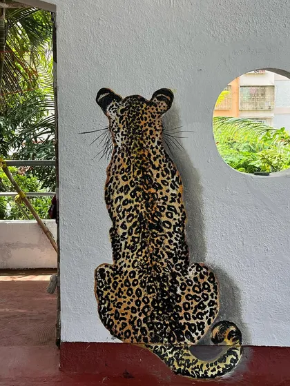 I had so much fun painting this leopard mural on our terrace. It's so realistic that it scares people the first time they see it!