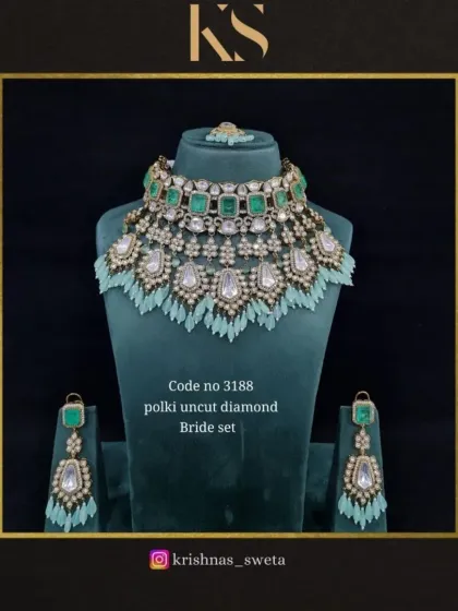 A polki uncut diamond bridal set with delicate mint green tassels. This piece combines traditional polki work with a modern design element.