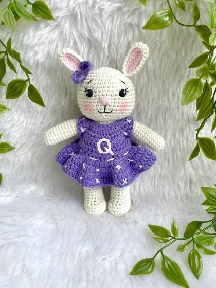 A lovely bunny in a purple dress with a custom initial "Q" on it. I made a similar one for my own daughter's birthday, and she absolutely adores it!