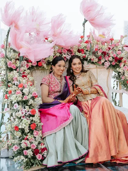 A heartwarming photo of the bride and her mother, sharing a special moment during the mehendi ceremony.