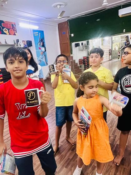 Another shot of the kids showing off their rewards. The studio is buzzing with positive energy after a successful event.