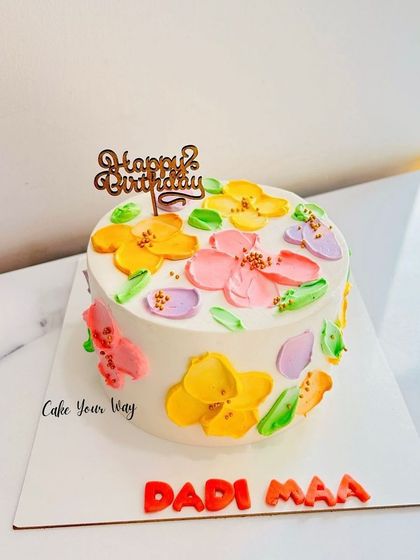 Simplicity at its best. A lovely cake with painted flowers for Dadi Maa.