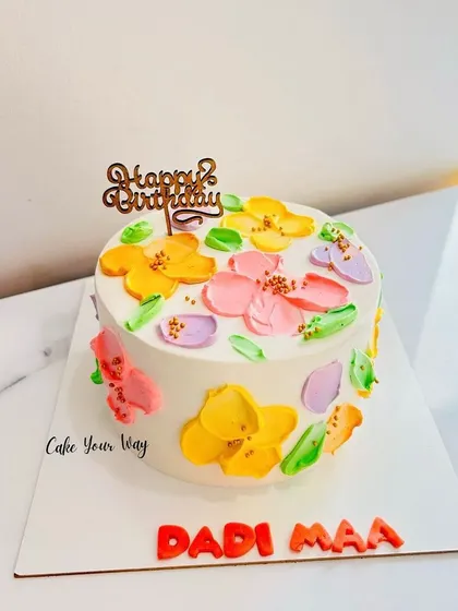 Simplicity at its best. A lovely cake with painted flowers for Dadi Maa.