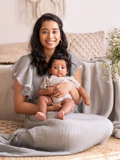 A beautiful portrait of a mother and her baby, sitting in our bright and airy studio.