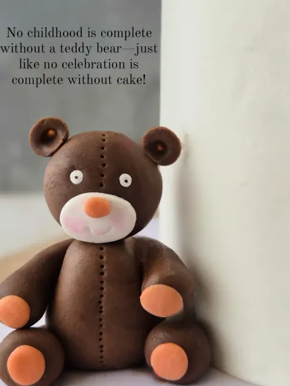 A close-up of a handcrafted teddy bear topper. No childhood is complete without a teddy bear, just like no celebration is complete without a cake.