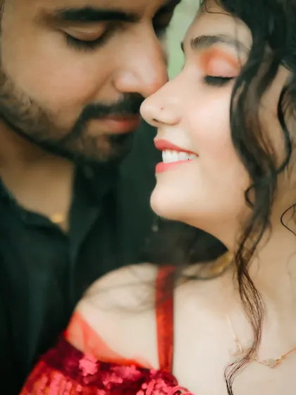 A beautifully artistic close-up focusing on the bride's serene expression and the groom's gentle presence. This shot is all about capturing subtle emotion and connection.