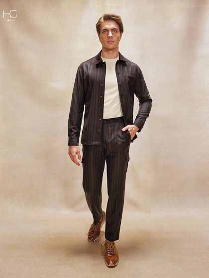 Break the monotony with the effortless appeal of vintage-inspired colors. This striped co-ord set in earthy brown tones offers a look that feels both modern and grounded in heritage.