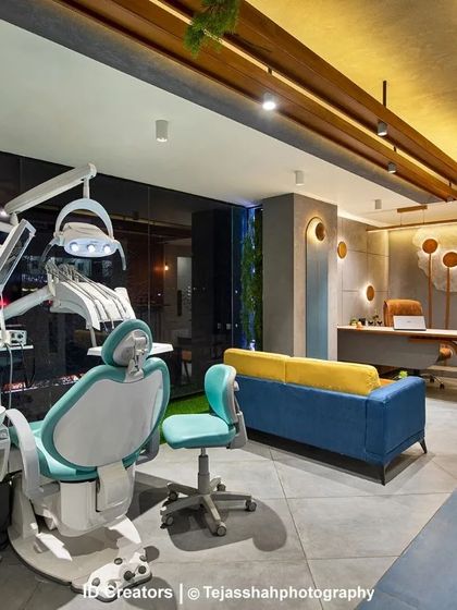 The main treatment room is designed to be calming, with a comfortable sofa for companions and a large window with views of the city.