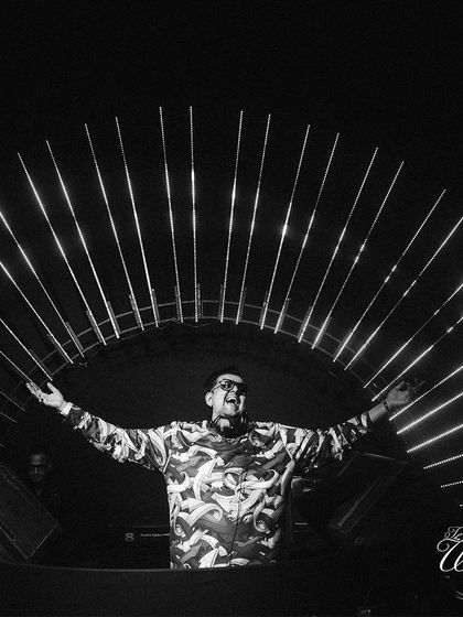 The DJ setting the mood for an epic after-party with a stunning light installation as his backdrop.
