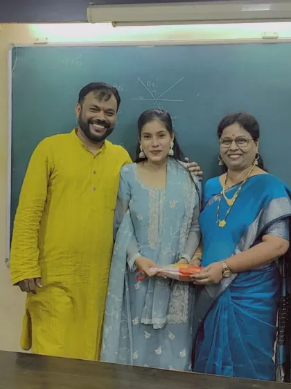 Another happy student receiving a Diwali gift. These moments of celebration make our classes a warm and welcoming place for everyone.