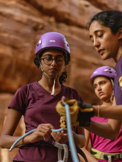 Women teaching women is at the core of what we do. Here, an instructor guides a participant through the essential knots for roped climbing.