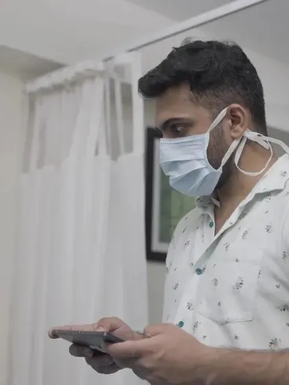 A shot from the Swift Robotics video demonstrating a user interacting with the system via a mobile device, highlighting the ease of use.