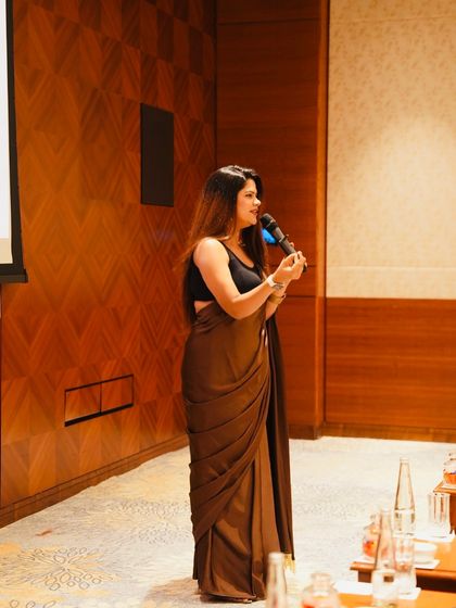 A close-up shot while addressing the audience. I ensure my delivery is clear, confident, and connects with every person in the room.