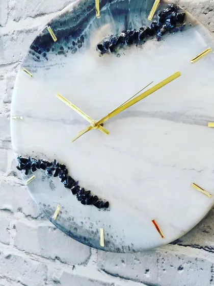 Another angle of this mesmerizing geode clock, showing how the light catches the different textures and colors.