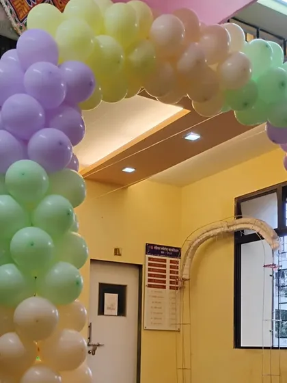 A simple yet beautiful pastel rainbow balloon arch, perfect for welcoming guests to any celebration, be it a birthday or a baby shower.