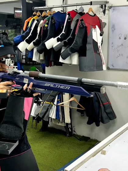 A shooter demonstrates perfect form during a 10m Air Rifle training session. My coaching focuses on building a stable stance, correct posture, and a consistent aiming process, which are the foundations of high-level marksmanship.